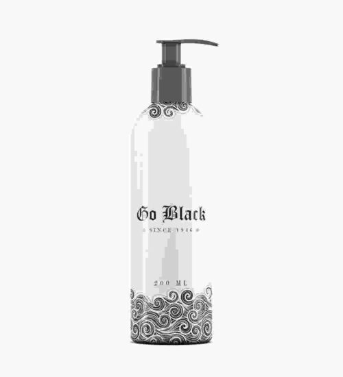 A bottle of black liquid with a floral design.