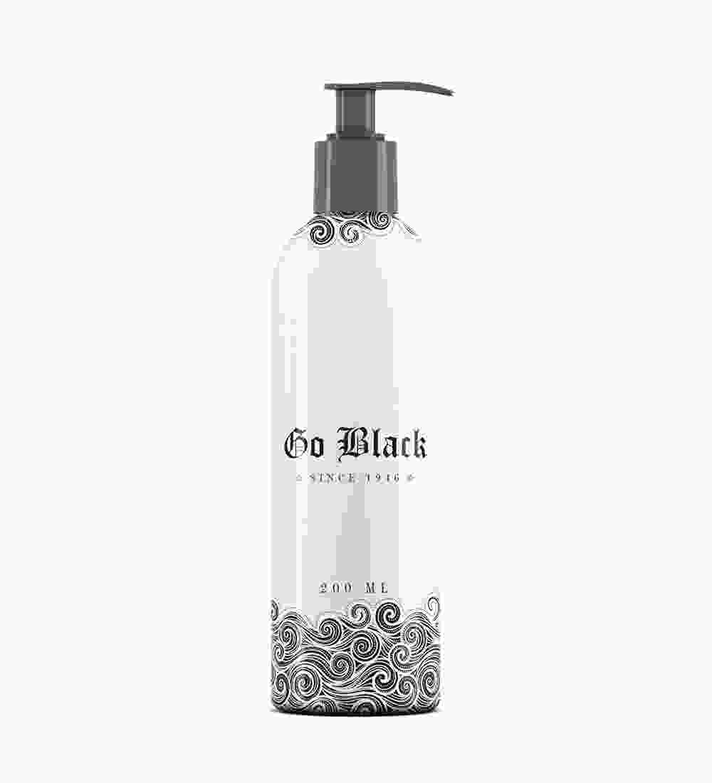 A bottle of black liquid with a floral design.