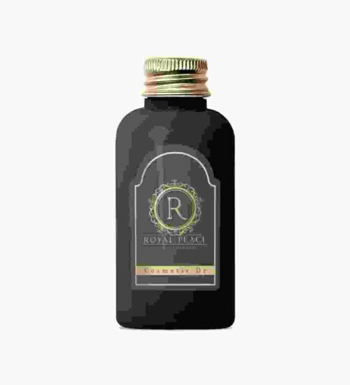 A bottle of black liquid with a gold lid.