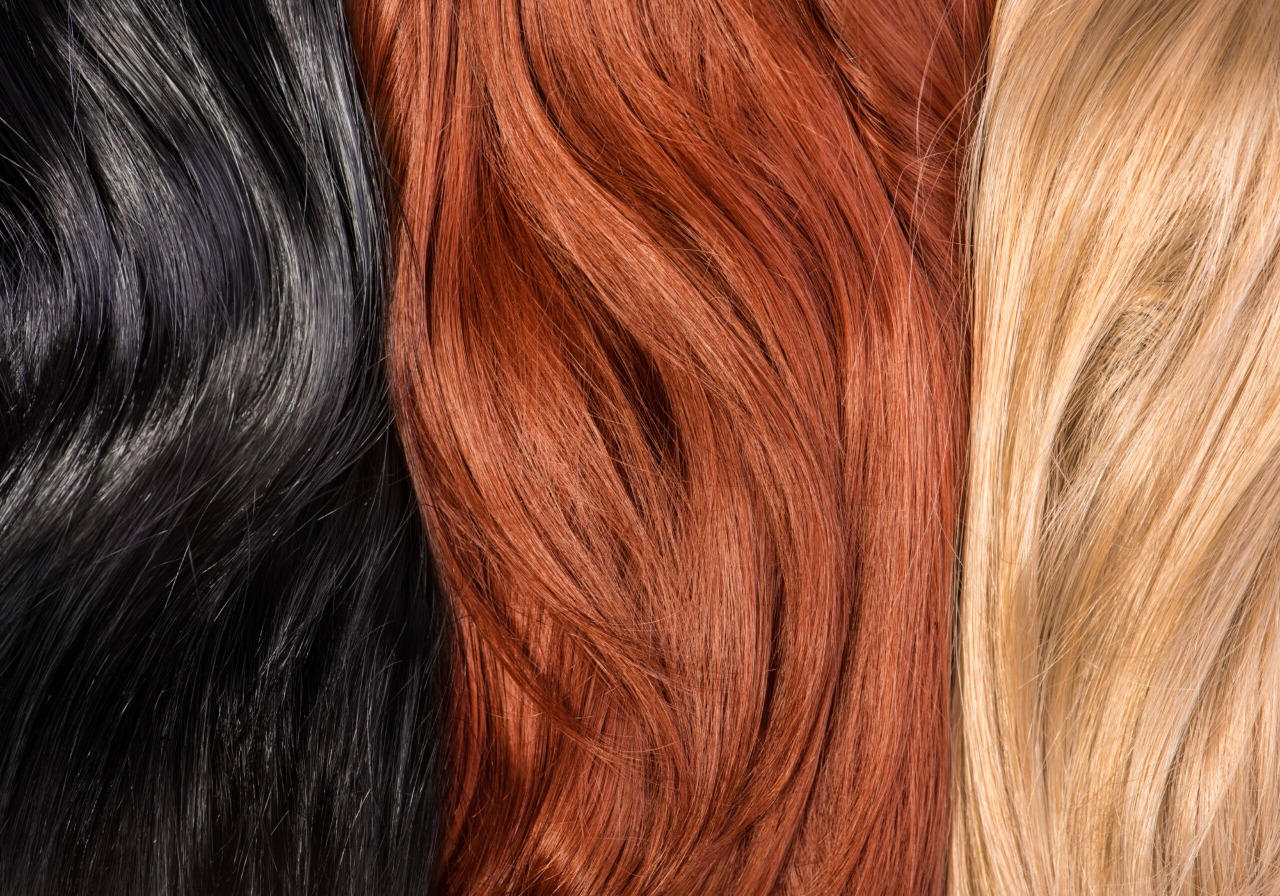 Black, auburn, and blonde hair strands.