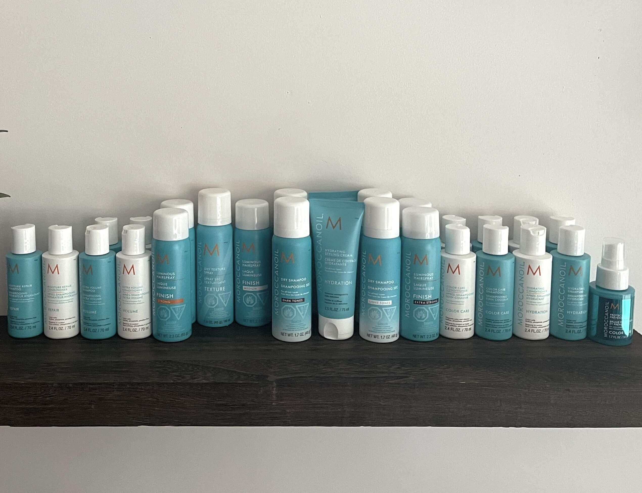 Moroccanoil hair products on shelf.